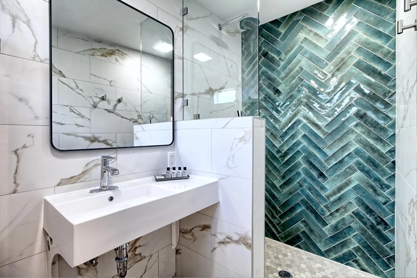 A bathroom with marble walls and floors